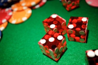 Live dealer studio shaking three dice during a Super Sic Bo round